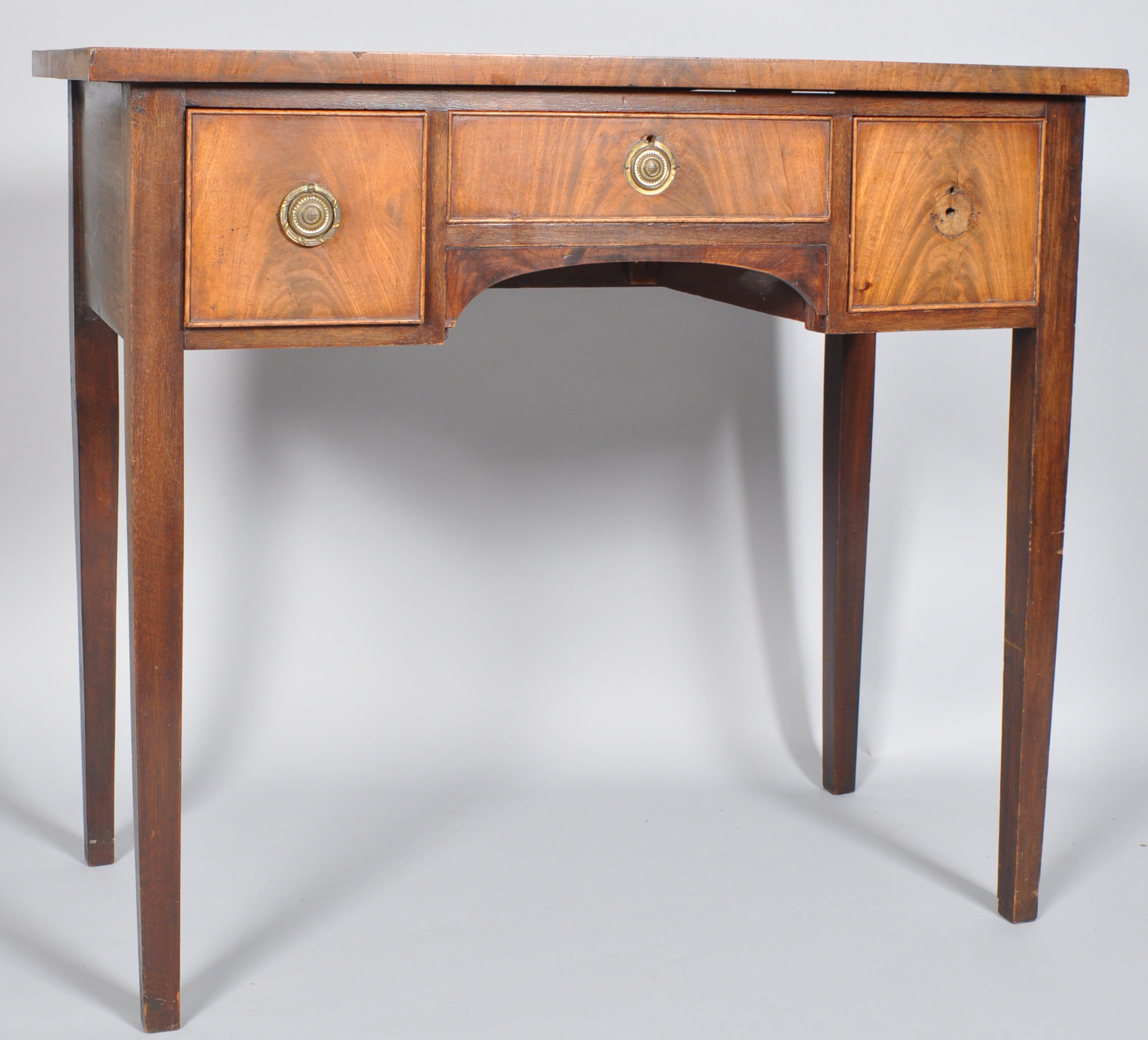 A 19th century mahogany sideboard with three frieze drawers on square tapering legs,