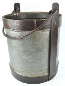 A wrought iron log bucket with swing handle,