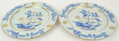 A pair of 19th century Spode stone china plates, printed in blue and picked out in gilt,