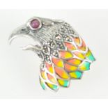 A white metal eagle head brooch/pendant set with marcasite and a cabochon cut ruby eye and finished