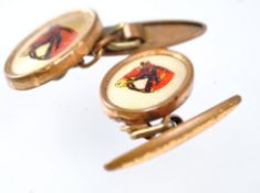 A pair of cufflinks, each printed with a hunter horses head,