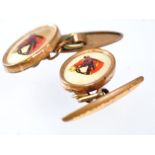 A pair of cufflinks, each printed with a hunter horses head,