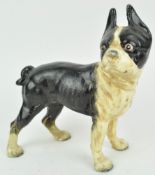 A cast iron figure of a French bulldog, painted black and white,