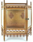 An oak framed hanging display cabinet, with bevelled glass door and sides,