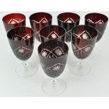 A set of eight Bohemian ruby flash and cut glass wine glasses,