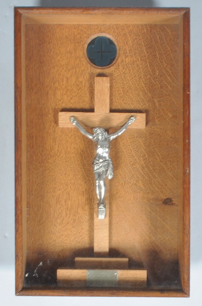 A Crucifix, in oak glazed case, the inscription 'Soignies 19th May 1917,