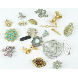 A collection of twenty costume brooches,