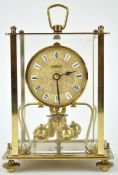 A Kein Anniversary clock, of traditional form, with rectangular four glass case,