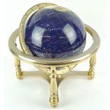 A 20th century table globe, inlaid with hardstones and shells,