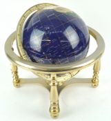 A 20th century table globe, inlaid with hardstones and shells,