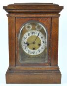 An oak cased bracket clock, with chiming movement,
