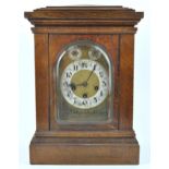 An oak cased bracket clock, with chiming movement,