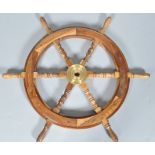 A hardwood ship's wheel, with brass centre,