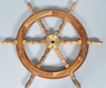 A hardwood ship's wheel, with brass centre,