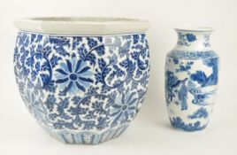 A Chinese porcelain jardiniere, painted in blue with scrolling lotus flowers,