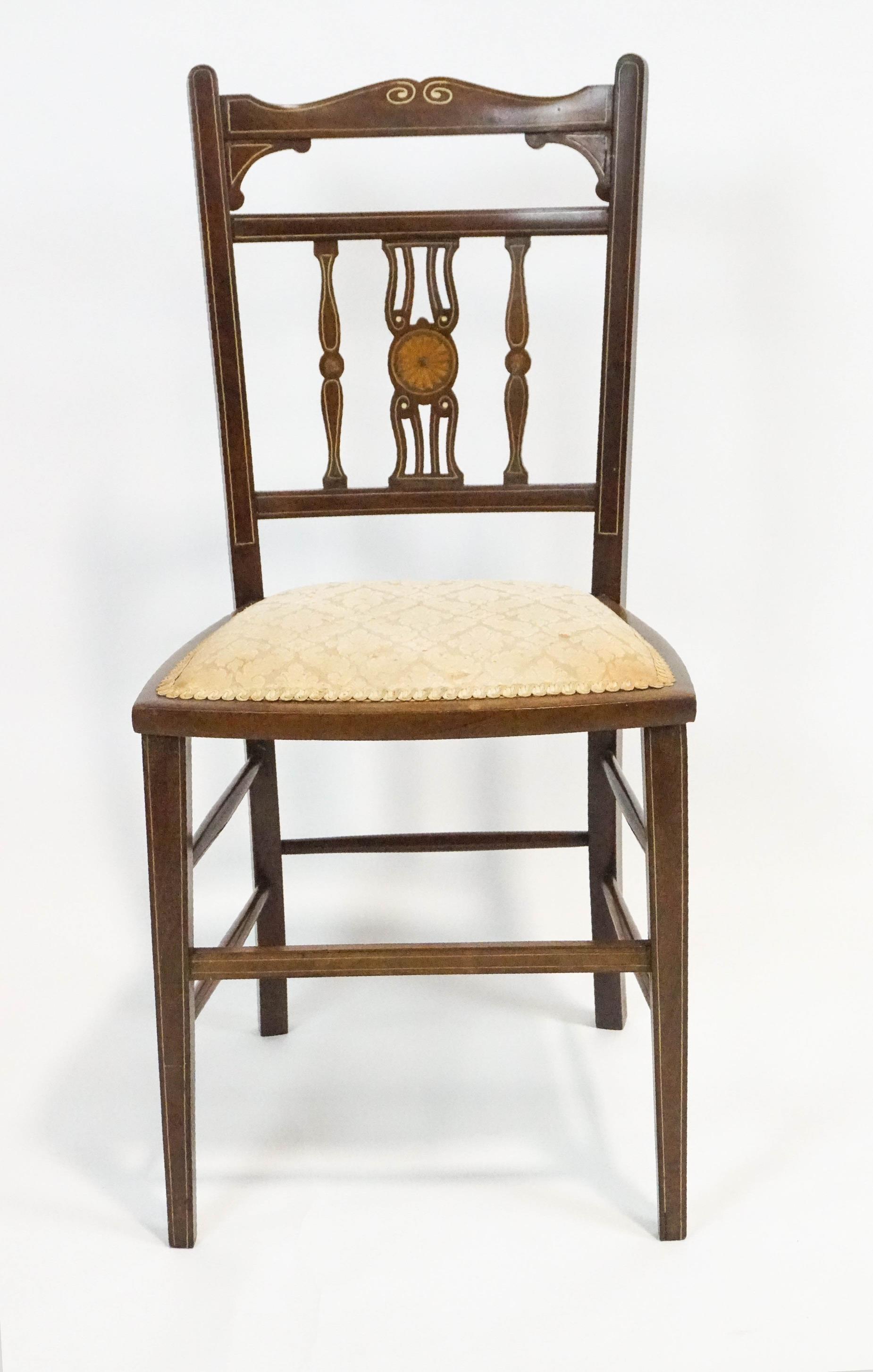 An Edwardian mahogany salon chair,