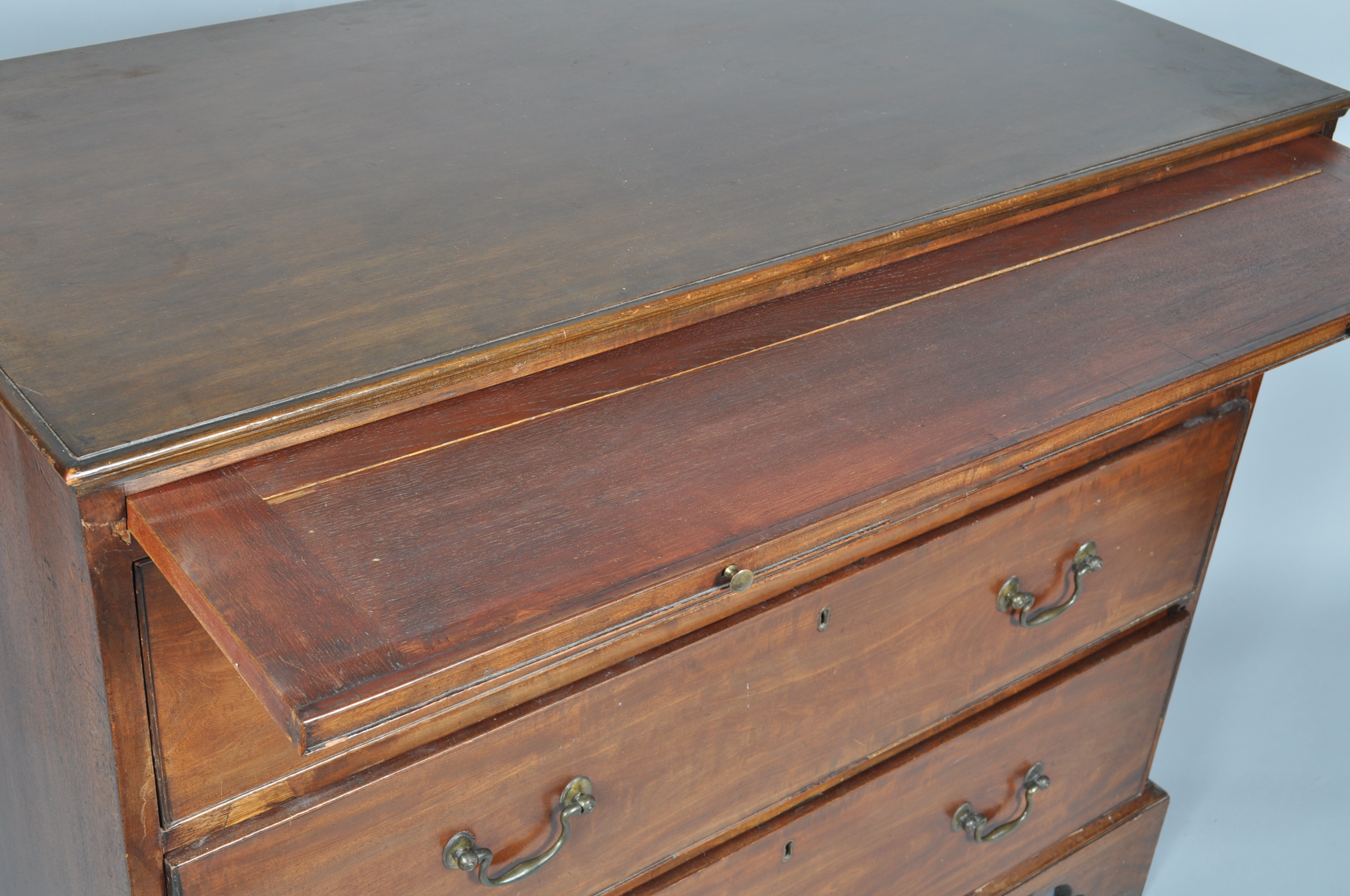 A 19th century mahogany chest of drawers with a brushing slide above three long drawers, - Image 4 of 4