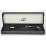 A boxed Mont Blanc ballpoint pen, in black and gilt with original box,
