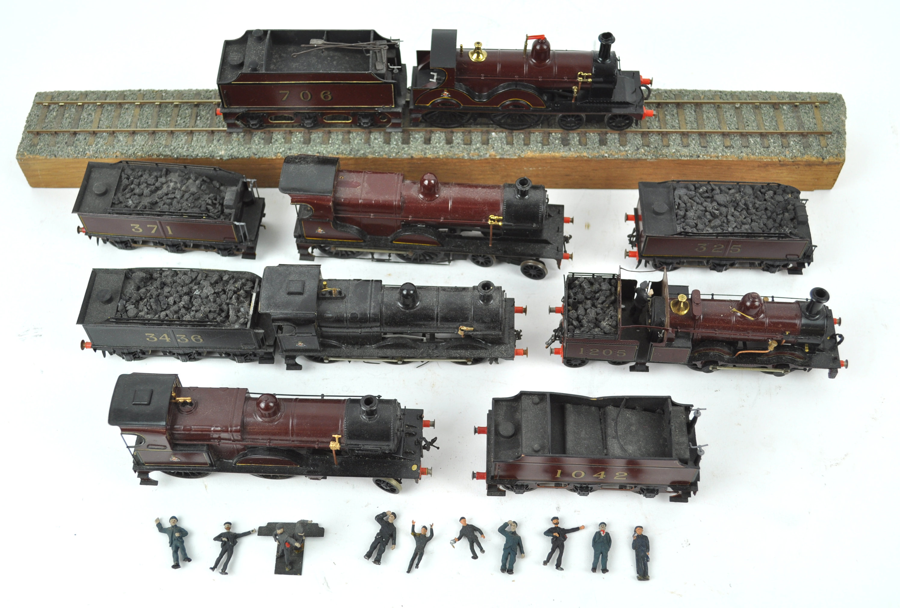 Five P4 model steam locomotives together with five tenders,