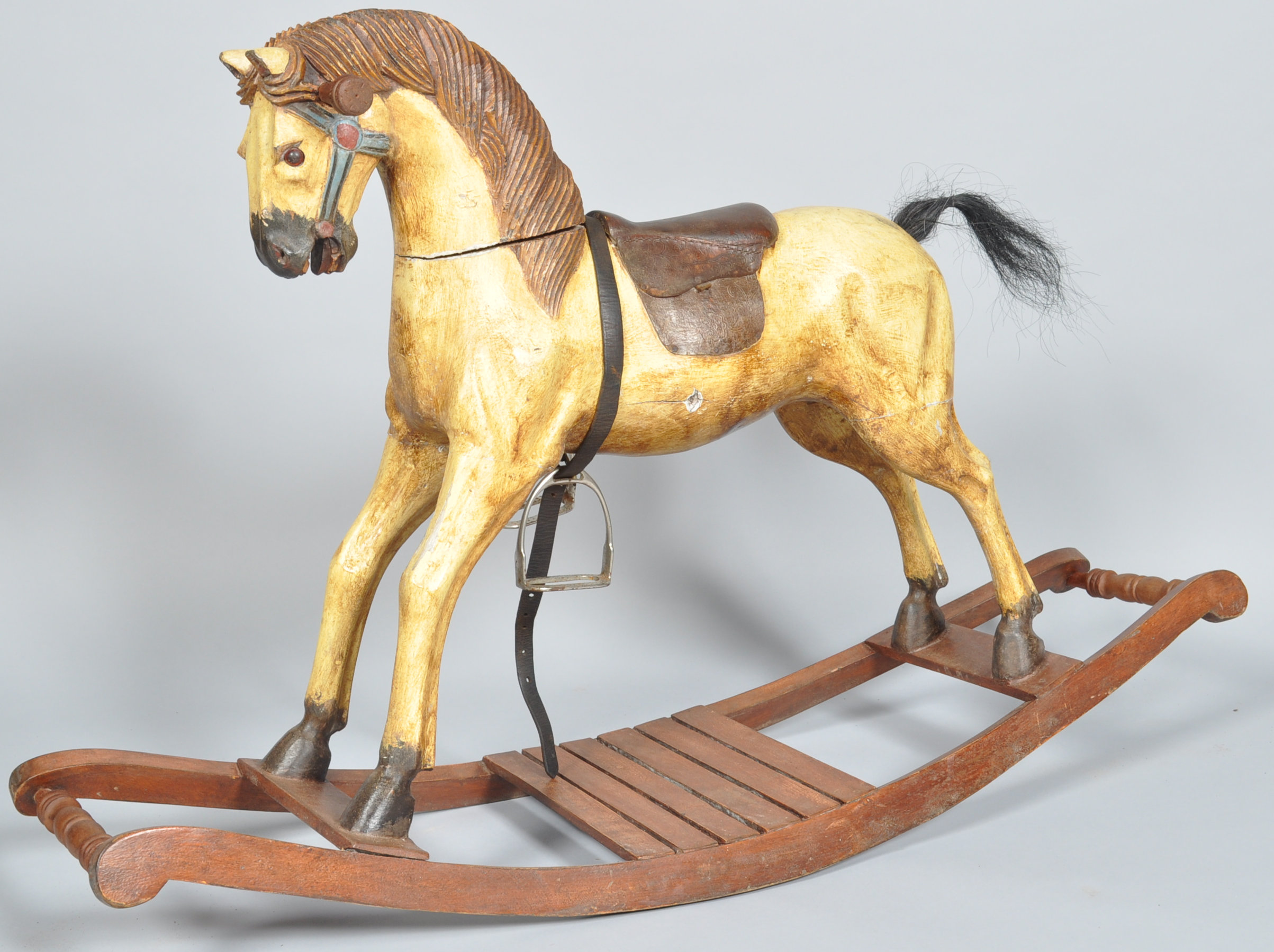 A 20th century carved rocking horse.