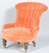 A late 19th century Victorian antique button backed nursing chair having a deep sprung seat,