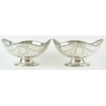 A pair of silver and neo classical style shaped oval bowls with rope work style undulating edges,