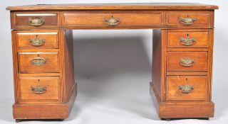 A late Victorian pedestal desk in walnut,