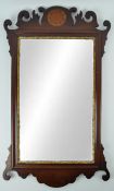 A mahogany fret framed wall mirror with marquetry crest,