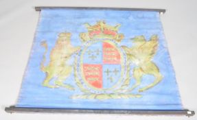 A heraldic wall hanging, possibly a stage prop, of double sided form,