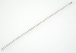A white metal line bracelet.