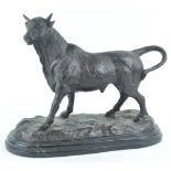 A bronze figure of a bull, after Antoine Louis Barye, on black marble plinth,