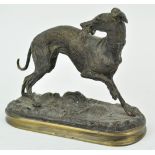 A bronze figure of a whippet on a naturalistic base, inscribed Y Mongmiey,