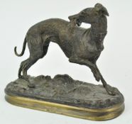 A bronze figure of a whippet on a naturalistic base, inscribed Y Mongmiey,