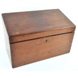 A mahogany stationery box, the sloped top opening to reveal various compartments,