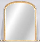 A gilt wood over mantel mirror of plain form with arched top,