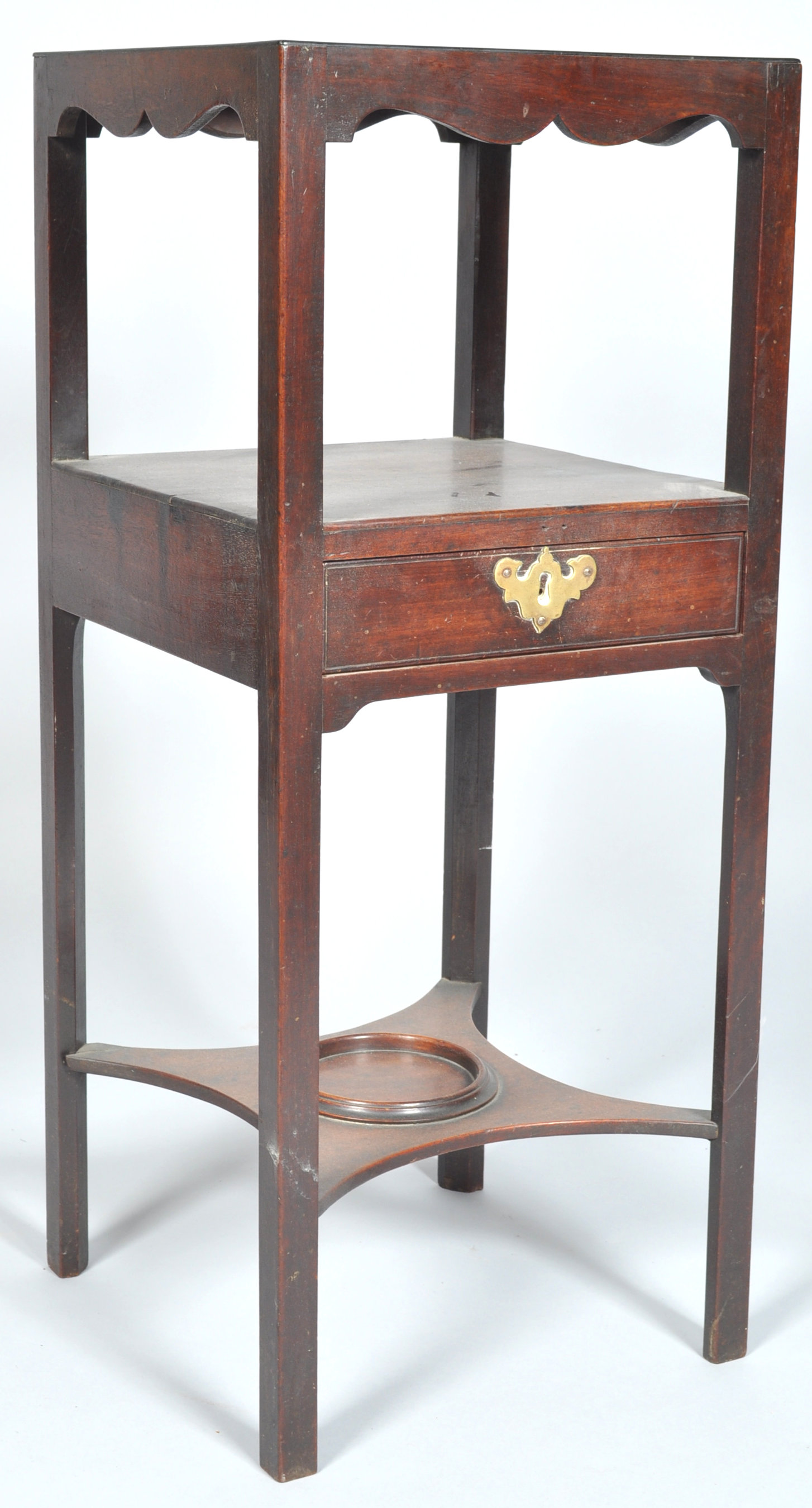 A late 19th century Victorian mahogany three tier wash stand having three hole section to the top