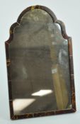 An early 20th century shaped easel dressing table mirror, the tortoiseshell frame inlaid with ivory,