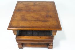 A mahogany cross banded square two tier occasional table on turned legs,