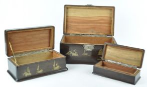 A camphor wood nest of three boxes, each inlaid in brass with Chinese junks,