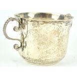 A silver two handled porringer, of plain round form, the S scroll handles with bead edge decoration,