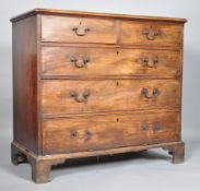 A George III mahogany chest of two short and three long drawers, on bracket feet,