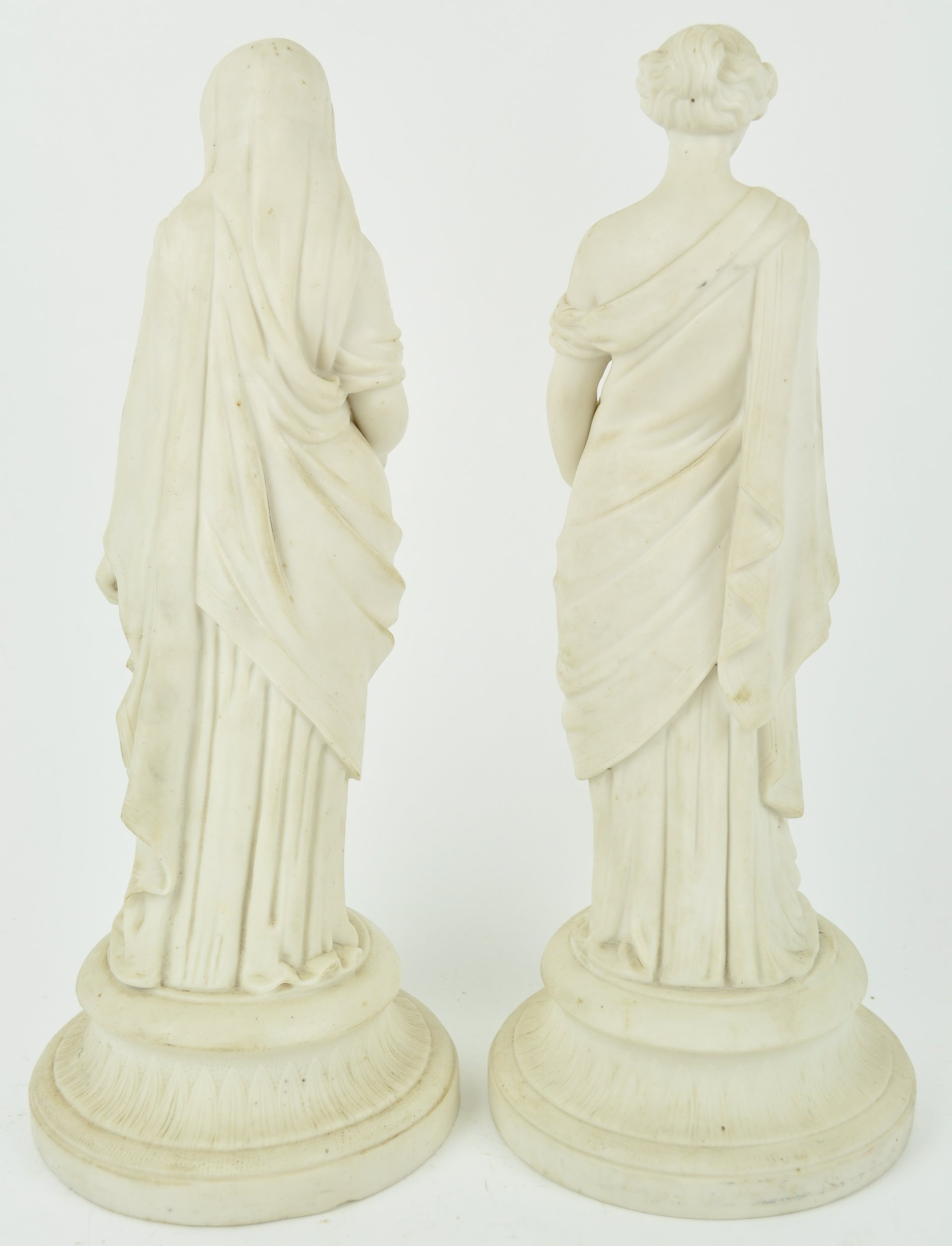 A pair of Parian figures of maidens in draped dresses, one holding a book, - Image 3 of 3