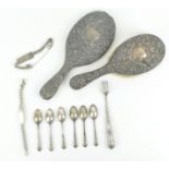 A silver collection to include a vanity mirror & brush, decorated with scrolls and masks,