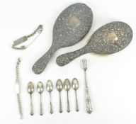 A silver collection to include a vanity mirror & brush, decorated with scrolls and masks,