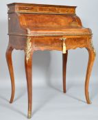 A ladies Louis XVI walnut and mahogany bureau with gilt metal mounts on tapering cabriole legs,