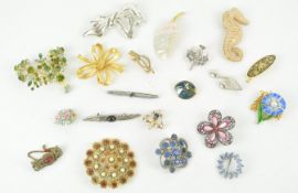 A collection of twenty costume jewellery brooches, of varying designs,