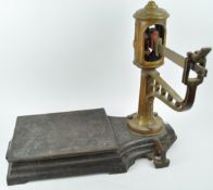 A set of cast iron and brass weighing scales, manufactured by A J Avery,