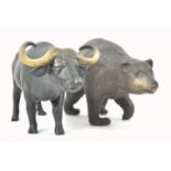 A Coalport bisque figure of a water buffalo, 21cm wide and a Coalport figure of a bear,