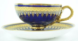 A 19th century porcelain cabinet cup and saucer with tooled gilt bands and white enamel jewelling