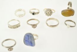 A collection of ten dress rings, three with silver hallmarks,